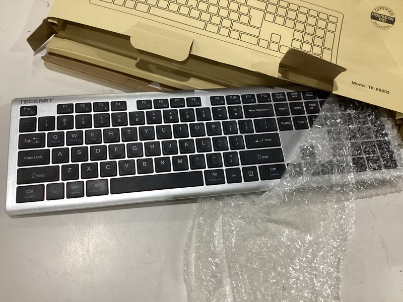 Condition photo showing As Is for tecknet bluetooth keyboard rechargeable, 4-device free switching (2.4g+bt), ultra-slim full size wireless keyboard, quiet typing, for pc/laptop/smart tv/phone, adjustable stand, 12 multimedia keys silver&grey