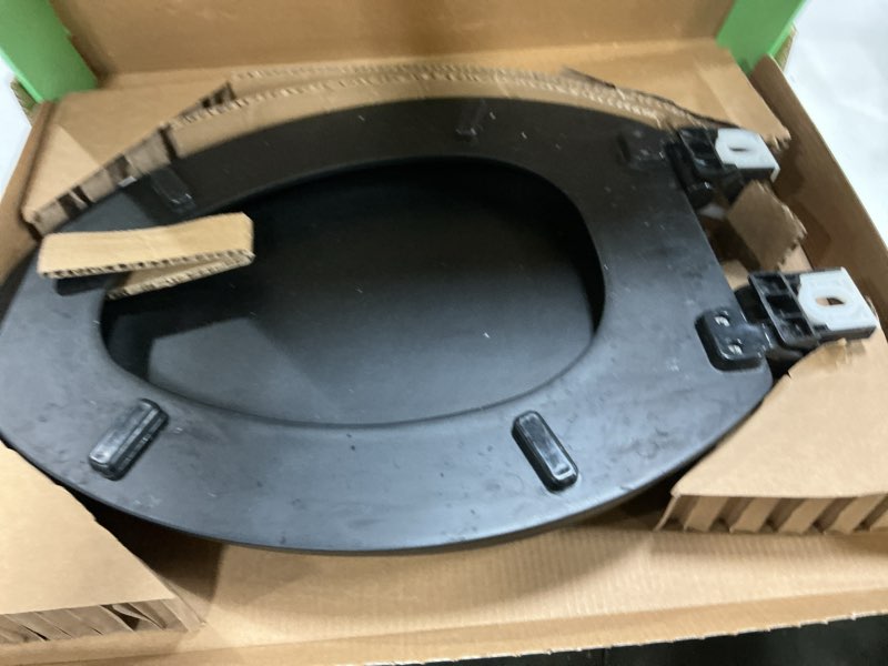Condition photo showing As Is for toilet seat, slow close, soft touch, ultra-smooth matte finish (no orange-peel texture), premium moulded wood, quick release, piklids (black, elongated) black elongated