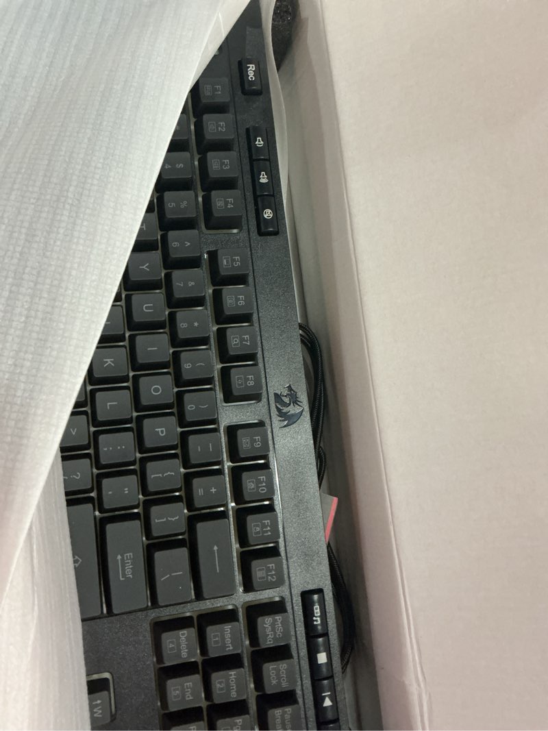 Condition photo showing New/Like New for redragon k512 shiva rgb backlit membrane gaming keyboard with multimedia keys, linear mechanical-feel switch, 6 extra on-board macro keys, dedicated media control, detachable wrist rest black 104 keys