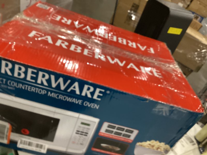 Condition photo showing As Is for Farberware 0.9 Cu. Ft. Countertop Microwave Oven – 900 Watts Power, Auto Cook Settings, Defrost, Easy Clean and Child Safety Lock - White 0.9 Cu. Ft White