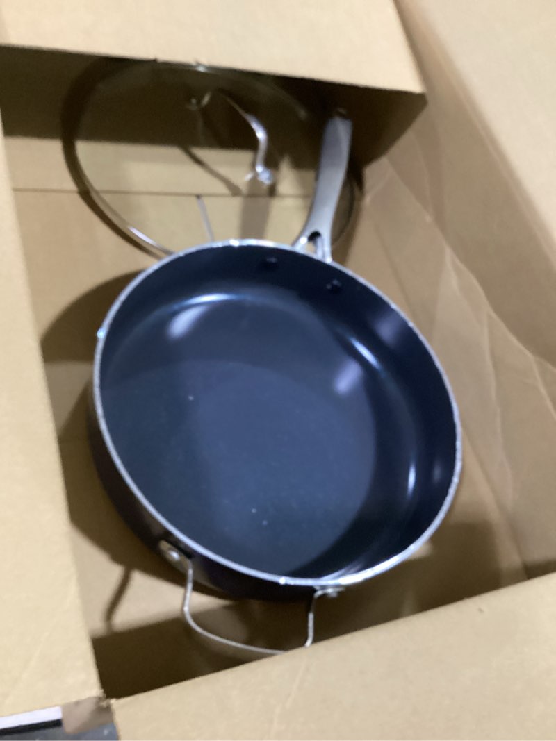 Condition photo showing New/Like New for blue diamond 5qt saute pan with lid, non toxic pfas-free diamond ceramic nonstick, dishwasher & oven safe, metal utensil safe, deep jumbo cooker skillet with helper handle, glass lid, blue blue 5 quart saute pan with lid