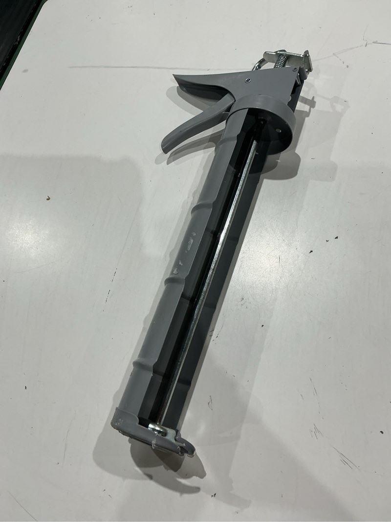 Condition photo showing As Is for project source smooth 28 -oz smooth rod caulk gun