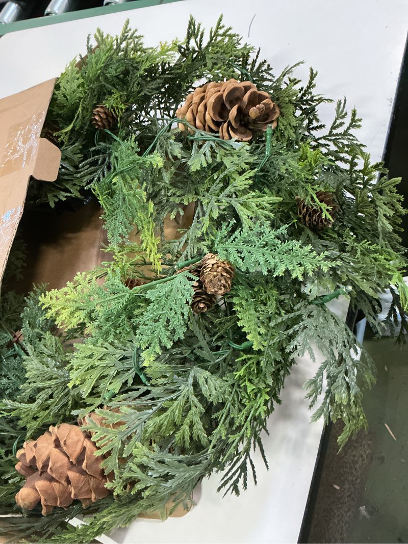 Condition photo showing New/Like New for 24-Inch Prelit Natural Wreath with 50 Warm White LED. Timer Function | Realistic Cedar and Mixed Greenery Holiday Decoration, for Front Door, Mantel, and Home Decor 1 Wreath