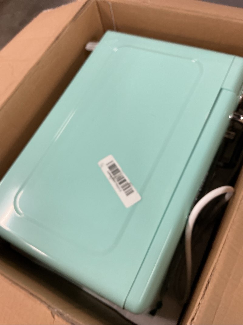 Condition photo showing As Is for Nostalgia Retro Compact Countertop Microwave Oven, 0.7 Cu. Ft. 700-Watts with LED Digital Display, Child Lock, Easy Clean Interior, Aqua Retro Classic 0.7 Cu. Ft. Aqua