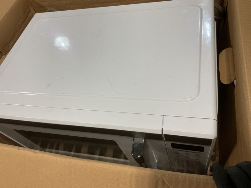 Condition photo showing As Is for mainstays 1.1 cu ft microwave oven in white
