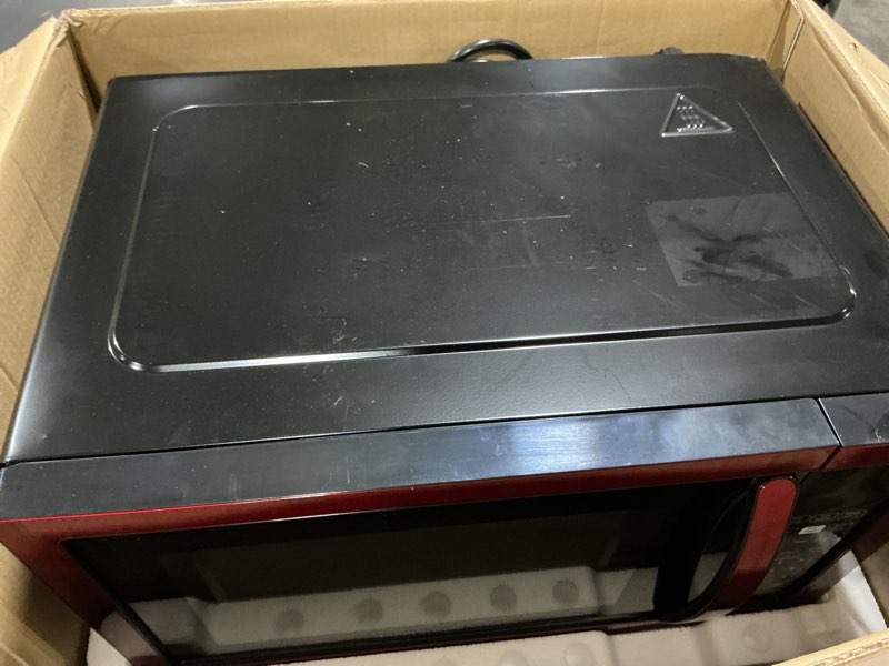 Condition photo showing Good Condition for Farberware 1.1 Cu. Ft. Countertop Microwave Oven – 1000 Watts Power, Auto Cook Settings, Defrost, Easy Clean and Child Safety Lock - Metallic Red 1.1 Cu. Ft. Metallic Red