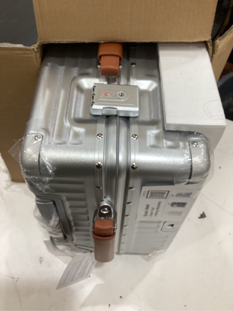 Condition photo showing As Is for 24 inch hardside checked luggage with leather handle, pc zipperless suitcase with spinner wheels and tsa locks, lightweight checked luggage for travel, silver silver (brown leather) checked in 24inch