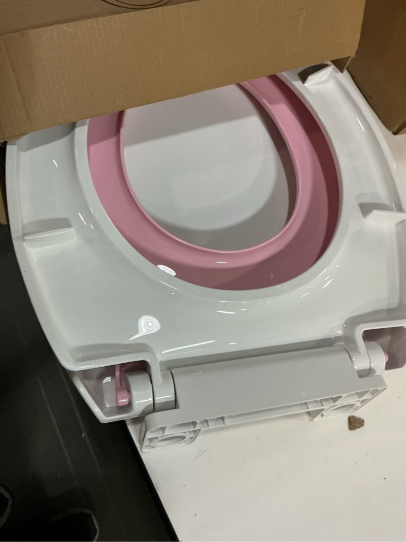 Condition photo showing As Is for potty training seat built-in toilet seat, round toilet seat 16.5inch with baby seat 2 in 1 soft close quiet no slapping, magnetic absorption, easy installation for bottom fixing toilet?white and pink pink round 16.5inch with baby seat & magnetic