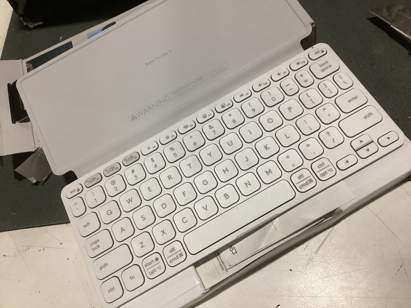 Condition photo showing Good Condition for logitech keys-to-go 2 portable bluetooth keyboard for tablet with built-in cover, slim and compact wireless keyboard for windows, android, linux, ipad, iphone, mac, apple tv - pale grey keys-to-go 2 universal pale gray