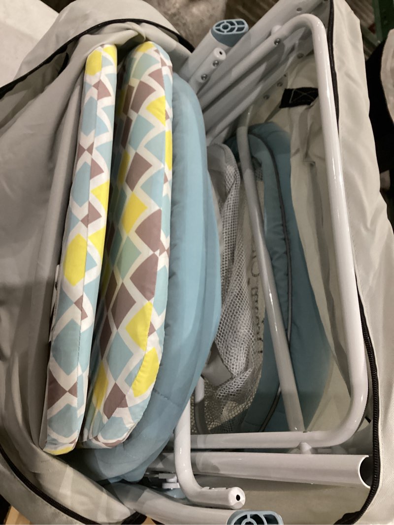 Condition photo showing Good Condition for dream on me poppy traveler portable baby bassinet, breathable mesh airflow panels, compact and lightweight, quick fold travel friendly design, anti-slip legs, travel bag and mattress included- blue