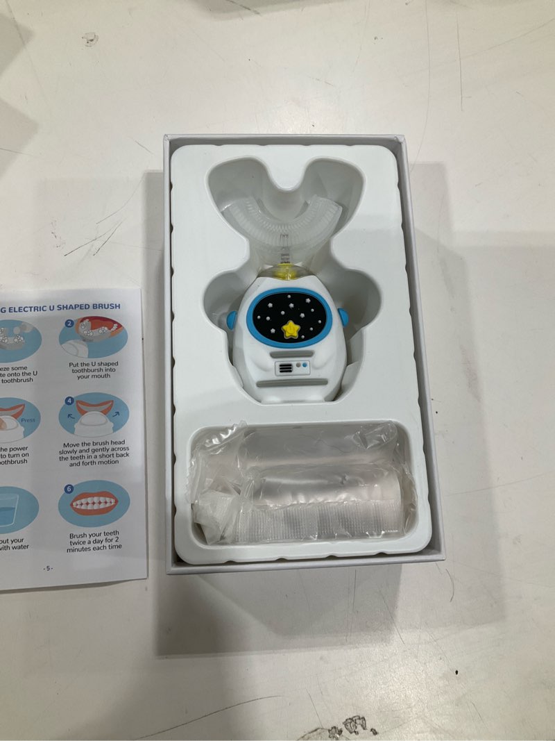 Condition photo showing Good Condition for kids u-shaped electric toothbrush for ages 3–7, voice guidance & music, 4 brush heads (includes soft bristle for back molars), training toothbrush for kids, type-c rechargeable (heroic white) heroic white 1 count (pack of 1)