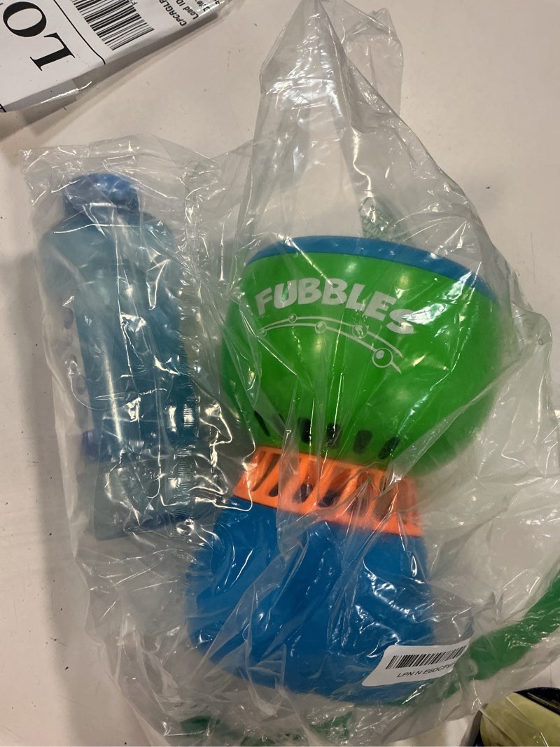 Condition photo showing As Is for fubbles no spill funfiniti bubble machine | blows one hour of non stop bubbles | amazon exclusive toy set includes 36oz of non toxic refill solution (bubble solution bottle colors will vary)