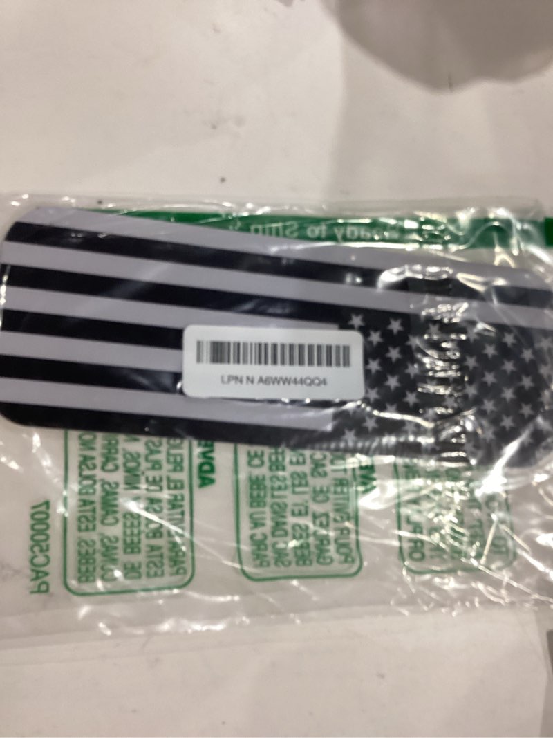 Condition photo showing Good Condition for E-Z-GO Golf Cart Front Name Plate with Black & Grey American Flag Design, Fits 2014-2022 TXT, 2010-2015 2FIVE, 2008-2017 RXV, 2012-2016 Terrain, 2010-2022 Valor, and 2017-2022 Elite