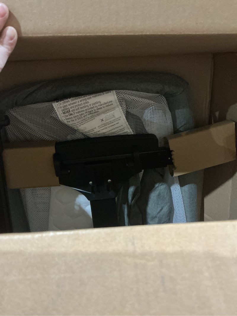 Condition photo showing As Is for Baby Bassinet,4 in 1 Bassinet Bedside Sleeper with Rocking Mode, 6 Adjustable Height with Mosquito Net,Breathable Mesh, Storage Basket, Safety Straps, Easy Assembly & Folding