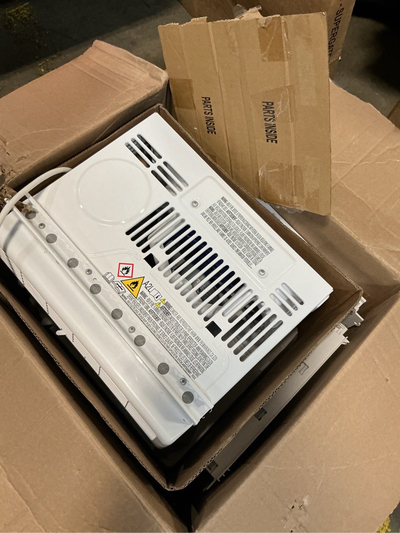 Condition photo showing As Is for amazon basics 5000-btu window air conditioner with quiet operation, up to 150 sqf, cool and fan functions, washable filter, adjustable window kit, intuitive mechanical controls, for small room, white white 5000 btu
