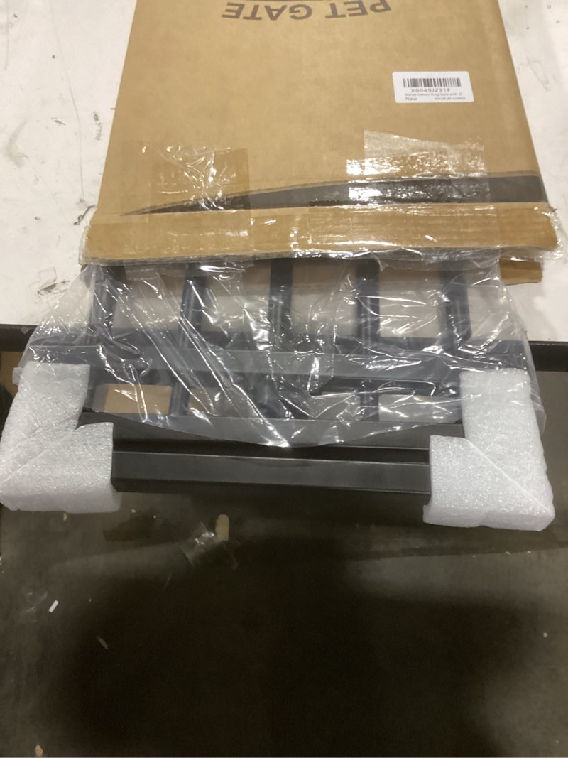 Condition photo showing Good Condition for Malier Indoor Dog Gate with Door, 26-41" Extra Wide Full Metal Pet Gate Short Dog Gate for Stairs, Pressure Mount 10'' Tall Small Puppy Low Gate Easy Step Over for Doorways Black 10''H × 26''- 41''W