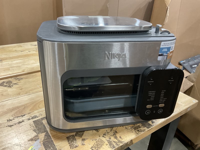Condition photo showing As Is for ninja combi all-in-one multicooker, oven, & air fryer, complete meals in 15 mins, 14-in-1 functions, combi cooker + air fry, bake, roast, slow cook and more, 3 accessories, stainless steel, sfp701