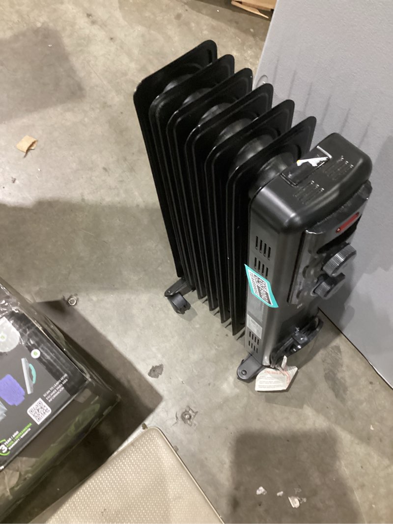 Condition photo showing As Is for  utilitech 1500 -watt oil-filled radiant utility indoor electric space heater with thermostat