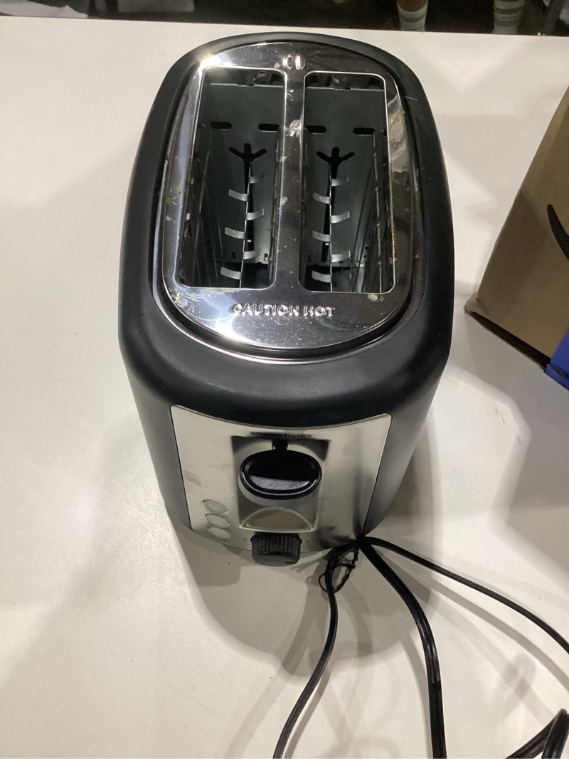 Condition photo showing As Is for elite gourmet 2-slice cool touch toaster – 6 browning levels, extra wide 1.25” slots for bagels & thick bread, cancel function, compact, etl certified, black 2 slice black, similar to stock photo, used