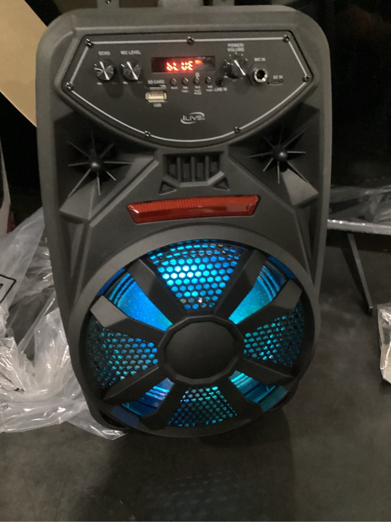 Condition photo showing New/Like New for working verified wireless tailgate party speaker with built-in 8 in. speaker, fm scan radio, retractable handle, wheels, led lights, blk