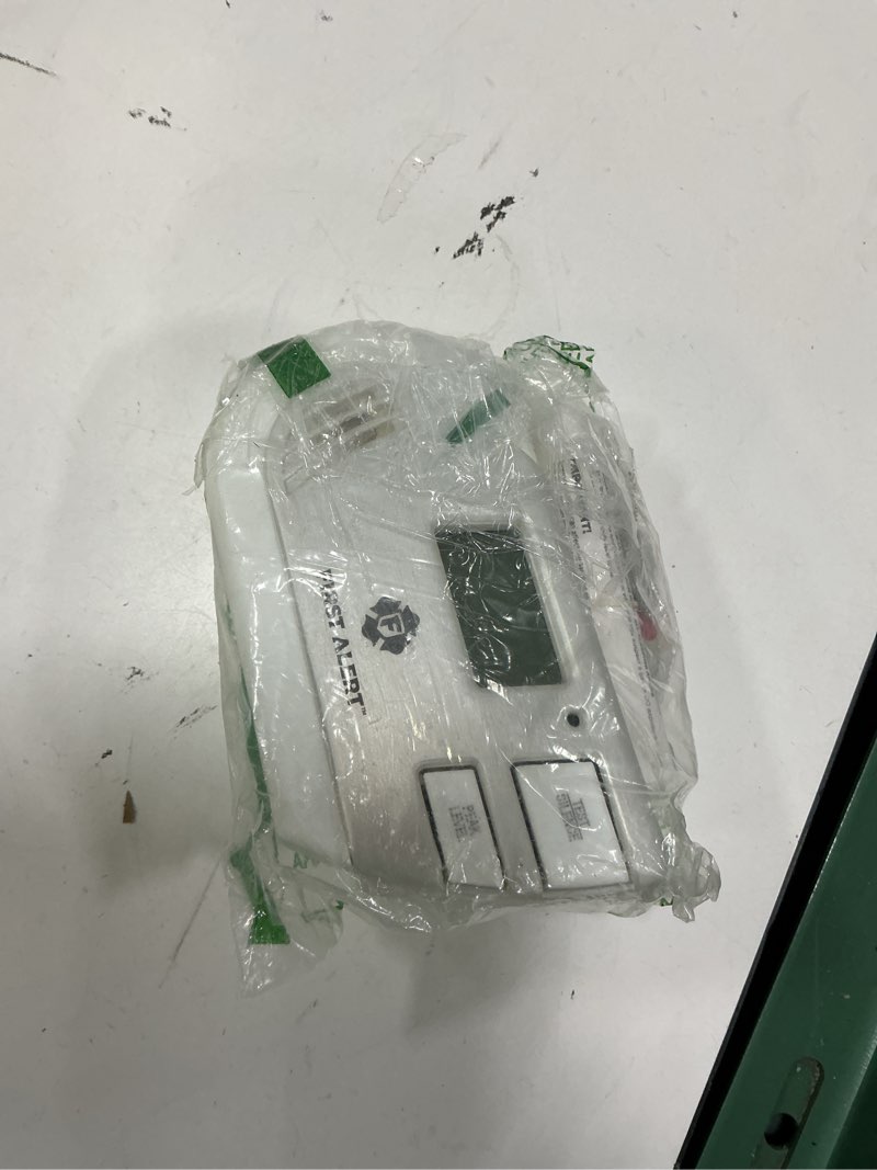 Condition photo showing As Is for first alert combination explosive gas and carbon monoxide alarm with backlit digital display, gco1cn