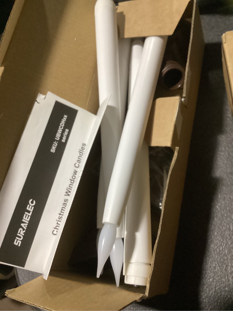 Condition photo showing Good Condition for suraielec 4 pack battery operated window candles, dusk-to-dawn flameless flickering candles, 3000k led window candle with rustic brown holder, christmas candle lights for windows, mantel, dining table 7'' candle brown