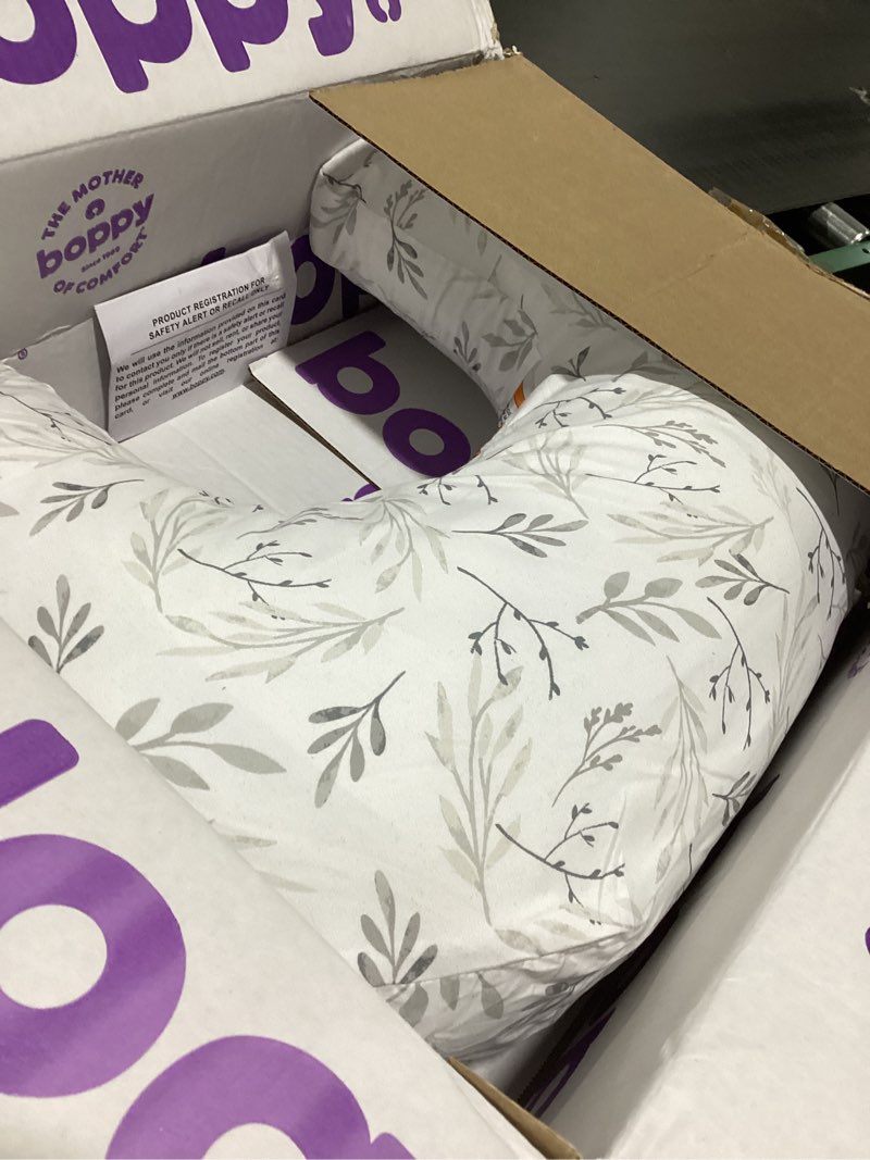 Condition photo showing As Is for Boppy Nursing Pillow - Ergonomic Bottle & Breastfeeding Pillow with High, Firm, Large Area, Water-Repellent Cushion with Washable Cover; Baby Safety Alliance Verified - Gray Gentle Leaves New Nursing Pillow Gray Gentle Leaves