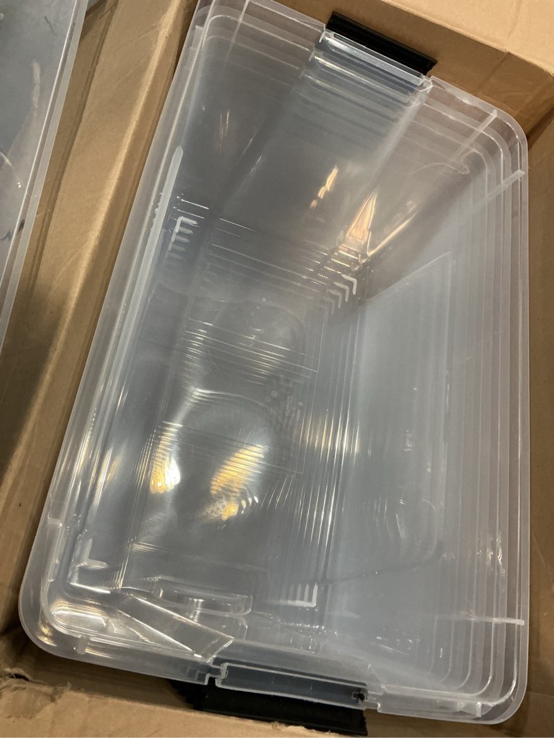 Condition photo showing As Is for iris usa 72 qt plastic storage box with lid and latches - 4 pack - bpa-free, see-through organizing solution, durable nestable stackable containers, secure pull handle - clear clear 72 qt 4 pack