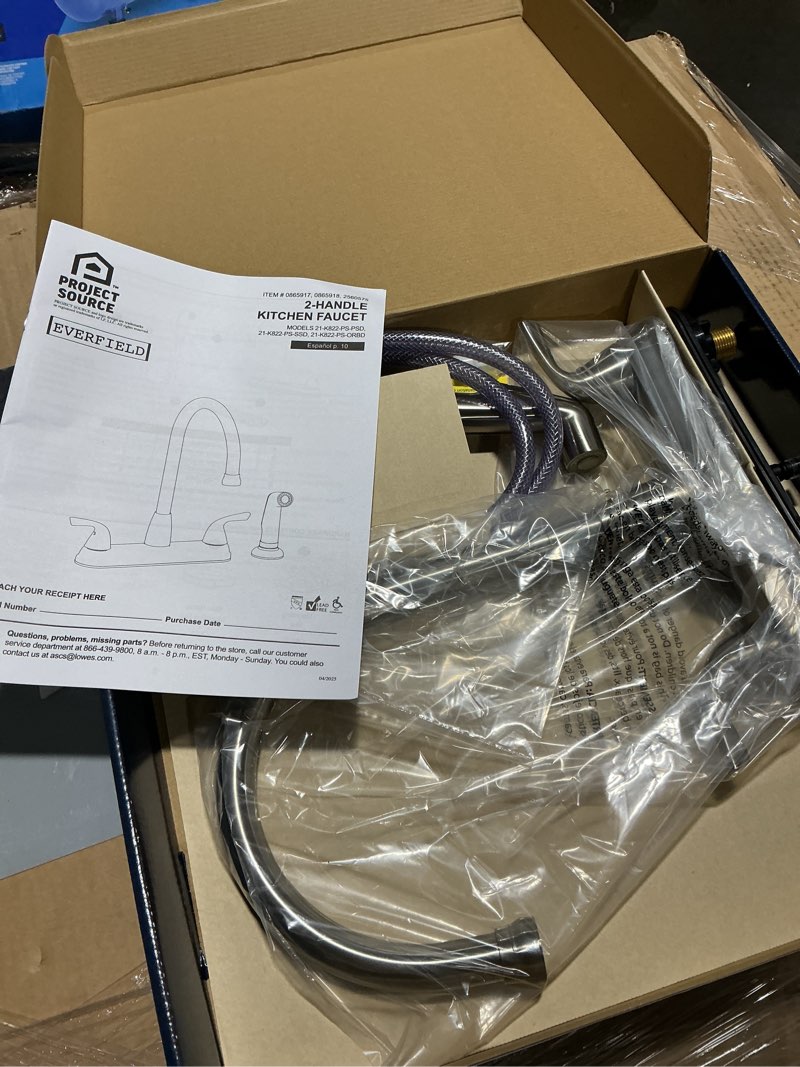 Condition photo showing As Is for project source everfield stainless steel double handle kitchen faucet (deck plate and side spray included)