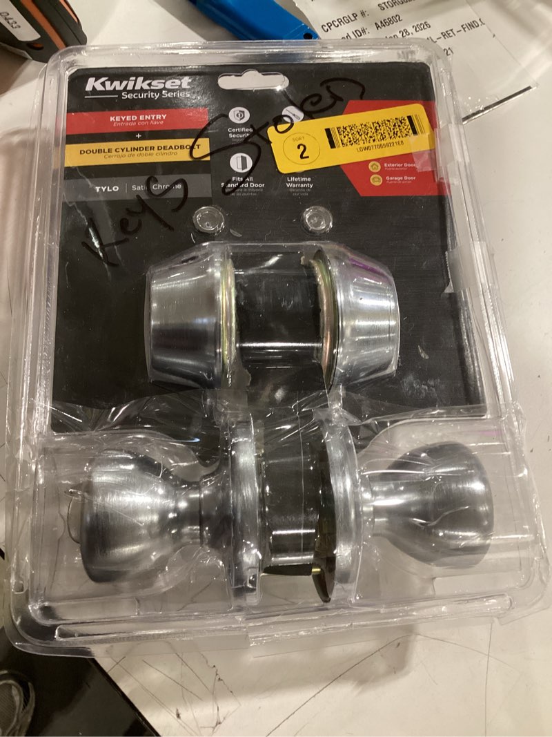 Condition photo showing As Is for incomplete  Tylo Satin Chrome Entry Knob and Double Cylinder Deadbolt Combo Pack