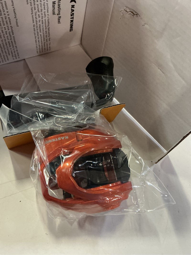 Condition photo showing Good Condition for kastking lethal blaze baitcasting fishing reel, 7.3:1 high-speed gear ratio, low-profile baitcaster, lightweight glass fiber-infused nylon frame, freshwater & inshore bass fishing reel right- shiny orange- 7.3:1