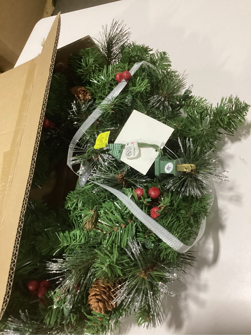 Condition photo showing Good Condition for National Tree Company 24 in Pre-Lit Crestwood Spruce Artificial Christmas Wreath, Christmas Decoration with Glitter, Pinecones, Red Berries, 50 Clear Lights, 160 Tips, Green