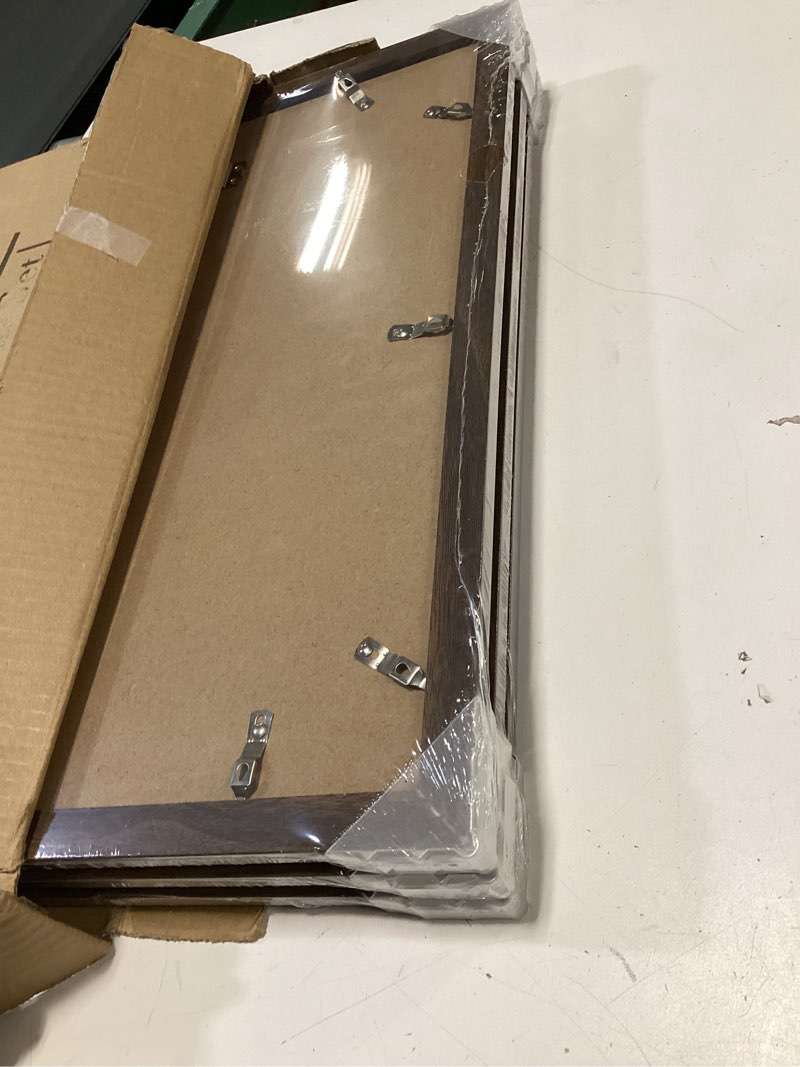 Condition photo showing New/Like New for KTKDE 12x16 Picture Frame Set of 3,Walnut Wooden frames, Vertical & Horizontal Wall Hanging for Wall Display,Studio Gallery Photo Frame for Photos, Posters & Art Prints Walnut Woodgrain 12X16in -3Pack