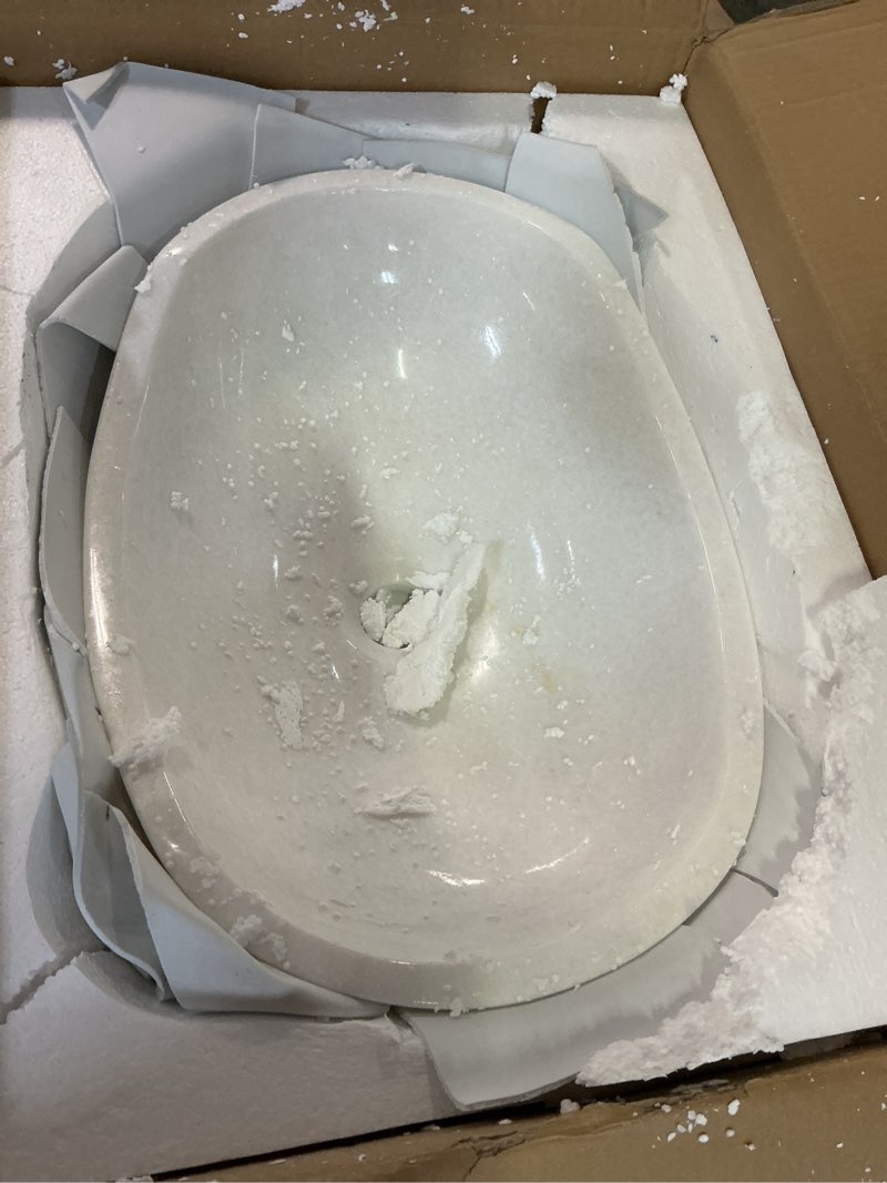 Condition photo showing Good Condition for natural white marble boat-shaped sink with irregular natural brown/black veining, 100% handcrafted. bathroom vanity sink—elegant and refined, suitable for bathroom vanities or countertops.
