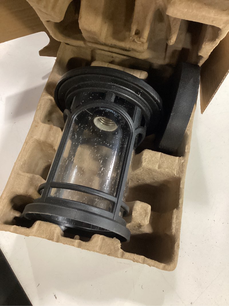 Condition photo showing As Is for quoizel kessel 1 -light 10-in h matte black hardwired outdoor wall light