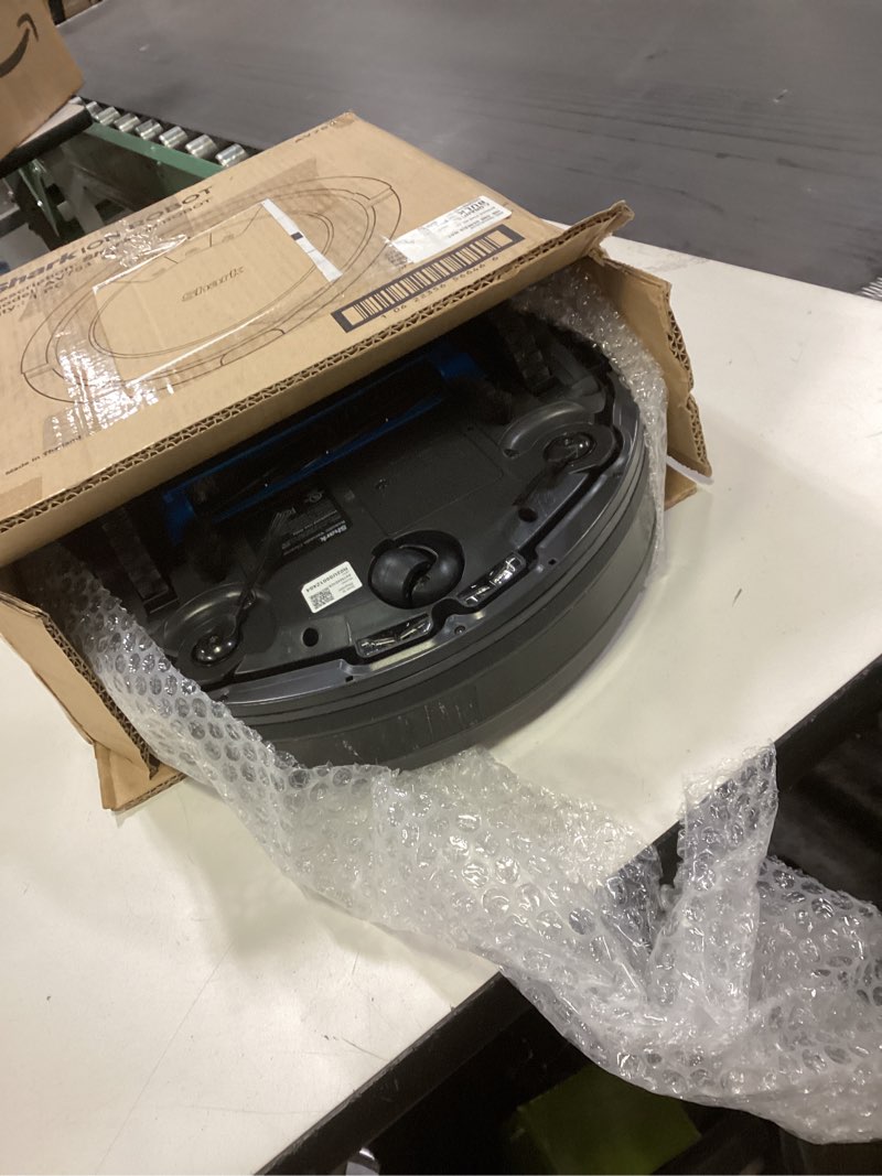 Condition photo showing As Is for Shark AV753 ION Robot Vacuum, Tri-Brush System, Wifi Connected, 120 Min Runtime, Works with Alexa, Multi Surface Cleaning, Grey ION Robot (Grey)