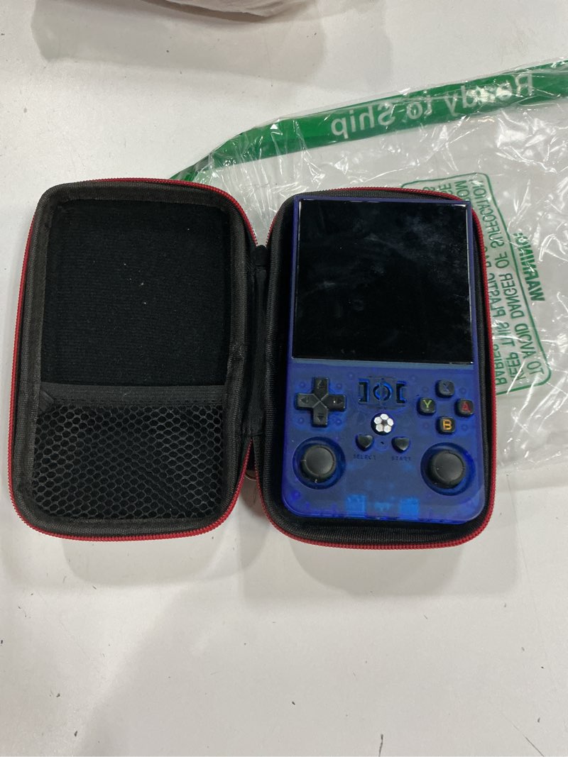 Condition photo showing As Is for r36max retro gaming console, 4.0 inch handheld game console with 64gb classic video games inchluded,support 30+ simulators,hand held game console for christmas-transparent blue blue-64gb (missing power cable)