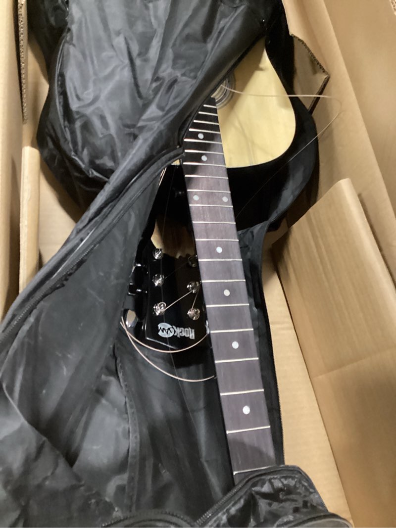 Condition photo showing As Is for (broken)RockJam Acoustic Guitar Kit with Stand, Tuner, Gig Bag, Strap, Picks, Spare Strings & Lessons Natural