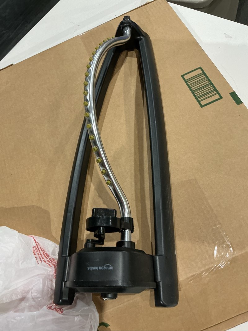 Condition photo showing Good Condition for amazon basics oscillating sprinkler for yard, one size, 1-pack, black
