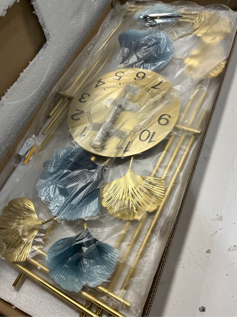 Condition photo showing Good Condition for gilacco large wall clocks for living room, silent non ticking battery operated oversized square modern wall clock for bedroom kitchen farmhouse office home wall decor-12.3x28.4inch(ginkgo leaf) 492-golden
