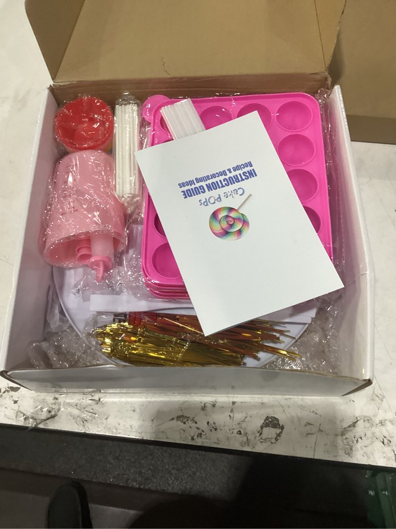 Condition photo showing Good Condition for cake pop maker kit with 2 silicone mold sets with 3 tier cake stand, chocolate candy melts pot, silicone cupcake molds, paper lollipop sticks, decorating pen with 4 piping tips, bag and twist ties 9.06*7.48*1.57 inch pink