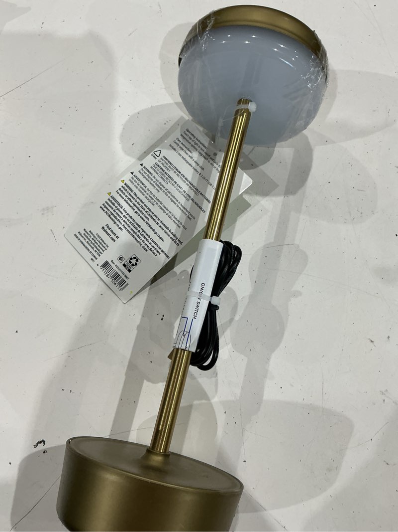 Condition photo showing As Is for mainstays 12 inch outdoor and indoor rechargeable water resistant table lamp  gold  100 lumens