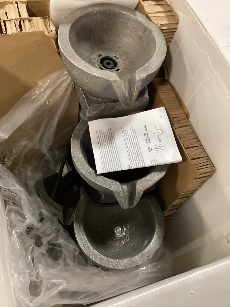 Condition photo showing As Is for style selections 27-inches h resin water tiered outdoor fountain pump included