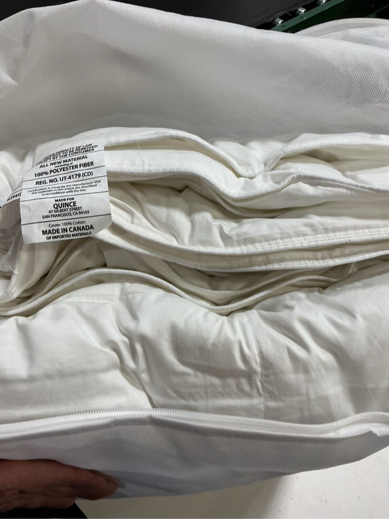 Condition photo showing New/Like New for quince premium down alternative comforter king/cal king lightweight