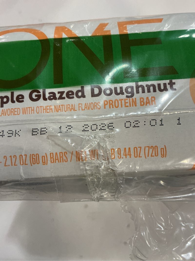 Condition photo showing New/Like New for (bb 12/2026)one protein bars, maple glazed doughnut, gluten free with 20g protein and 1g sugar, pantry staples, 2.12 oz (12 count) 2.12 ounce (pack of 12) maple glazed doughnut