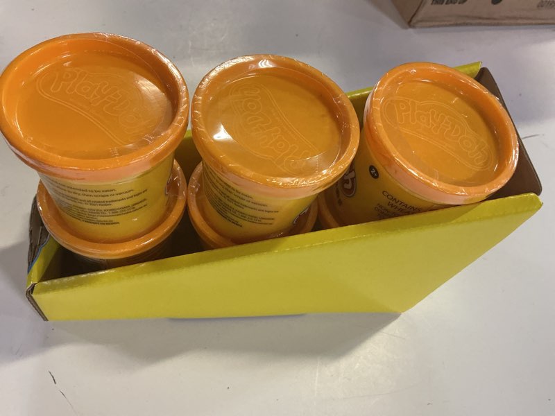 Condition photo showing New/Like New for playdoh (orange) pack of 6