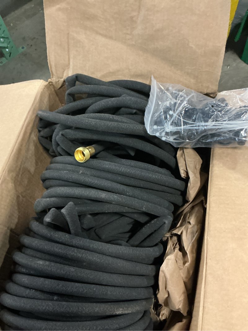 Condition photo showing As Is for soaker hose 150ft heavy duty rubber saves 75% water end cap included for additional hose connect great for gardens/flower beds