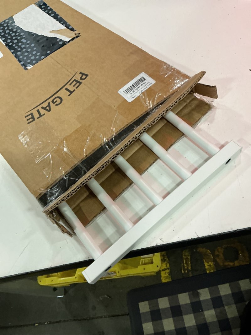 Condition photo showing As Is for malier dog gate with a small door, extra wide all metal short dog gate pet gate for stairs, 10'' tall pressure mount easy step over puppy gate low gate for doorways white 10''h × 26''- 41''w