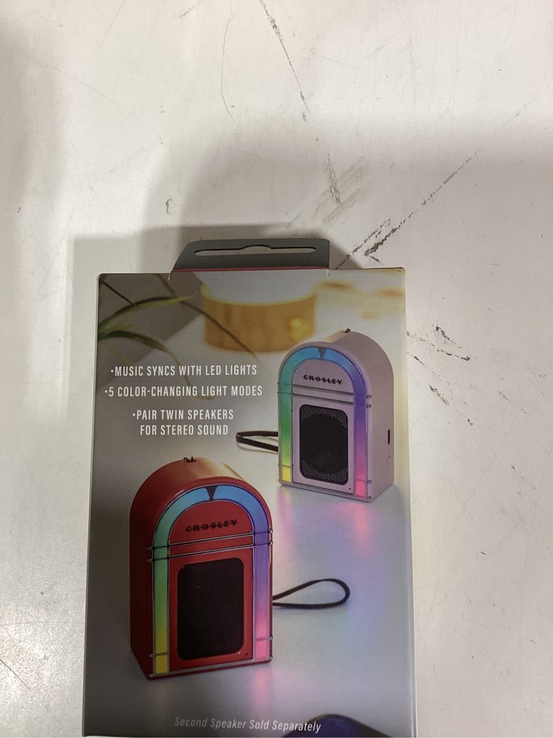 Condition photo showing New/Like New for Crosley CR3046A-RE Mini Jukebox Portable Bluetooth Speaker with LED Lights and Microphone, Red