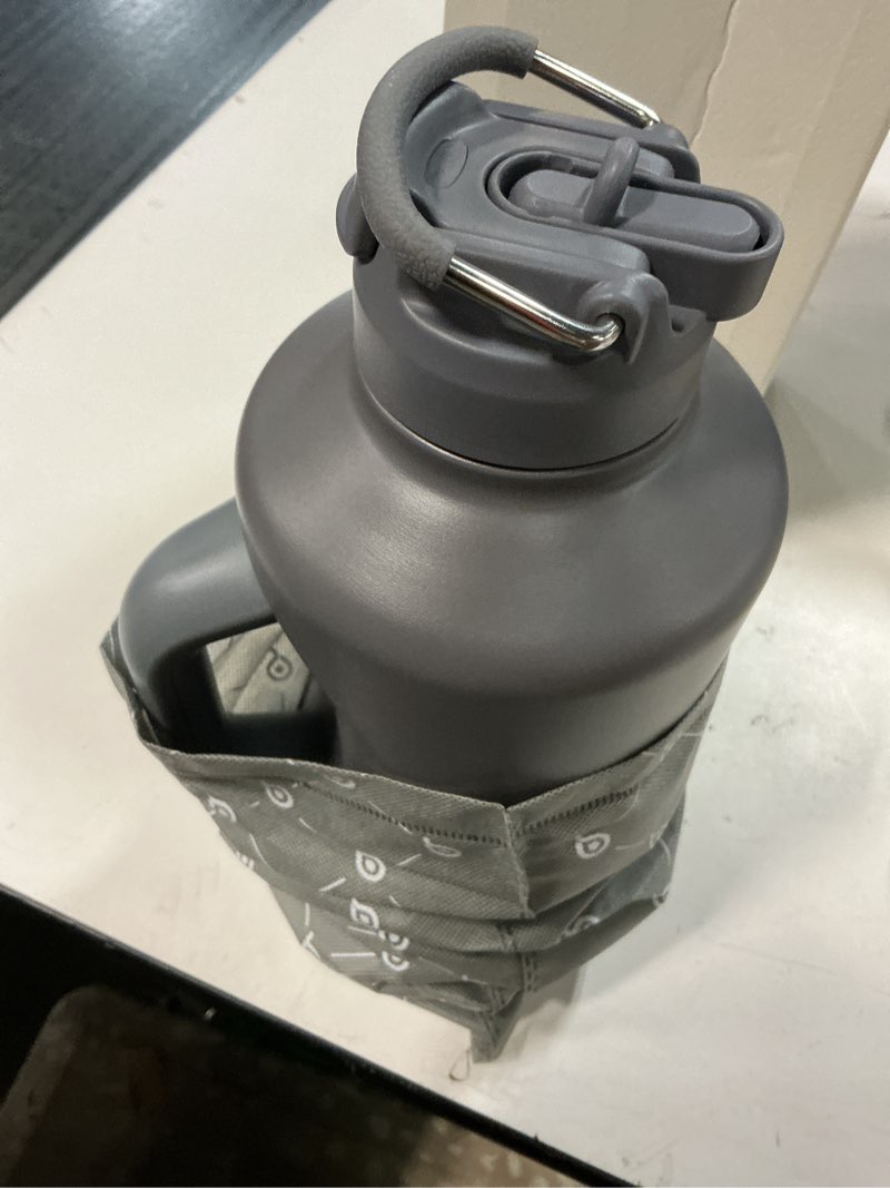 Condition photo showing New/Like New for bottle bottle insulated water bottle 64 oz with straw and dual-use lid stainless steel water bottle for men with handle vacuum insulated beer growler for workout sports soccer gray
